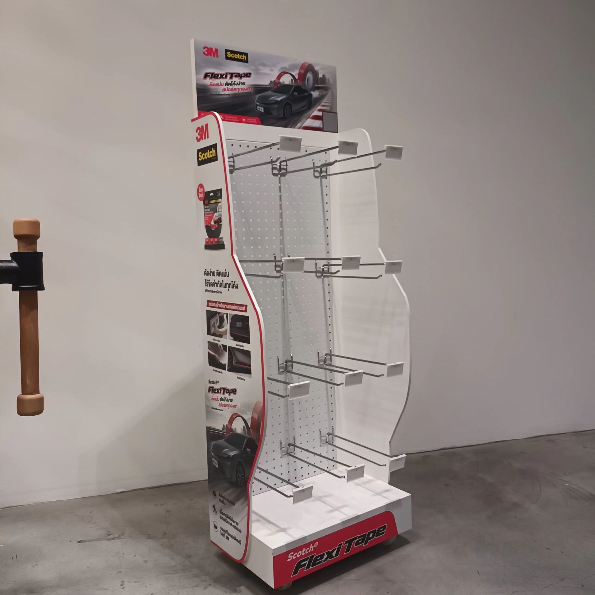 Curved-profile display stand with product hooks