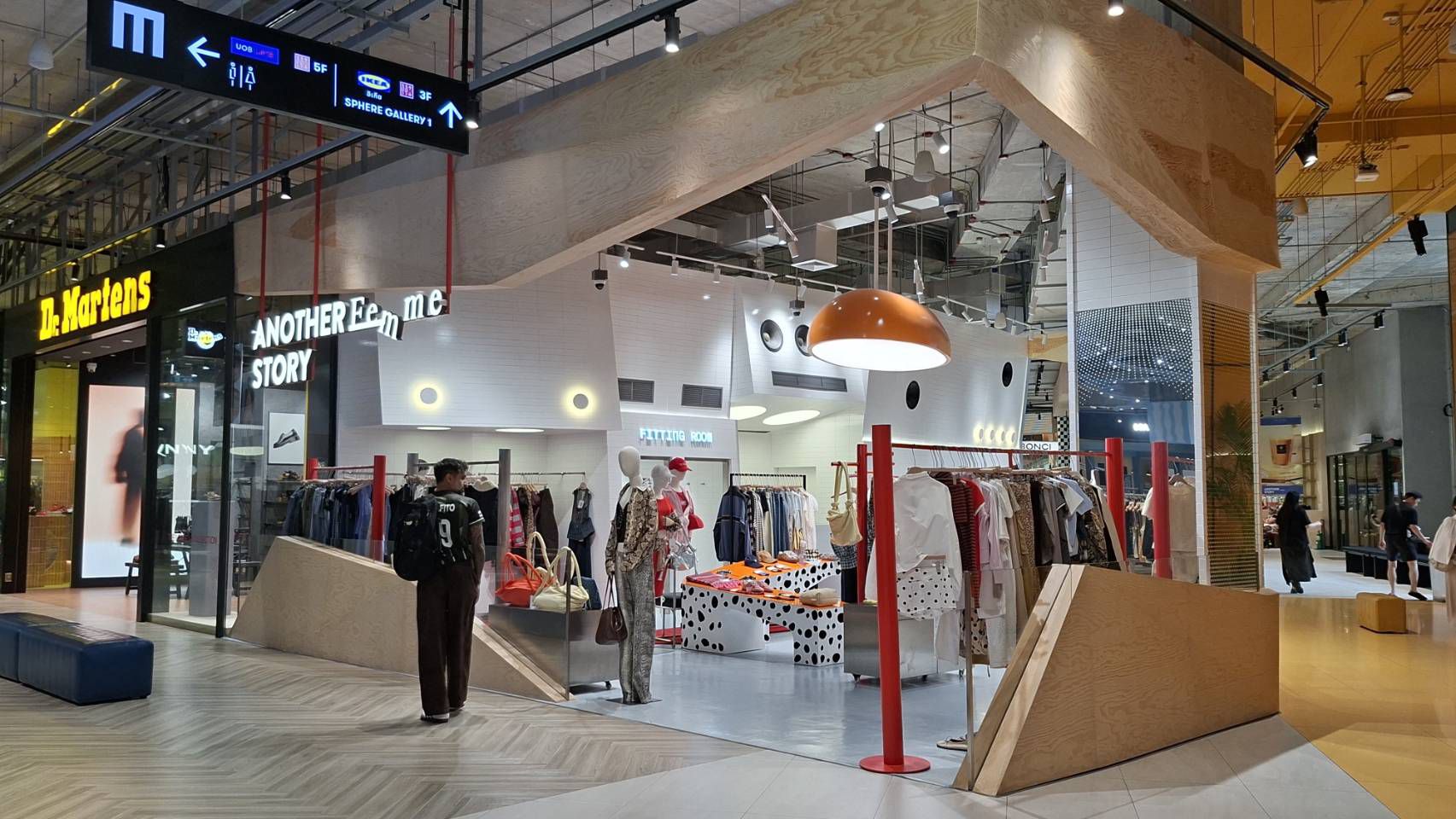 Another Story at Emsphere — plywood sloped architecture and signage