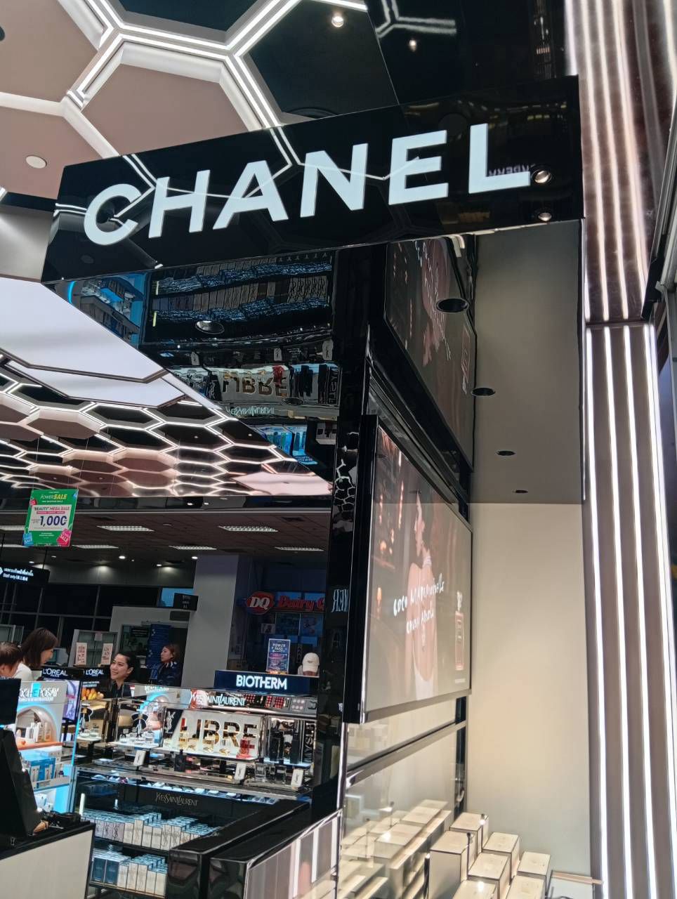 Black lacquer bay with illuminated CHANEL signage