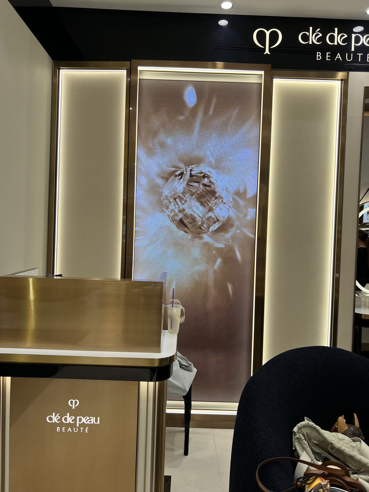 Backlit brand panel over the counter
