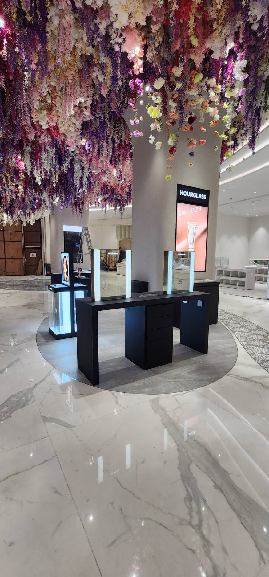 Fixtures under the floral ceiling installation