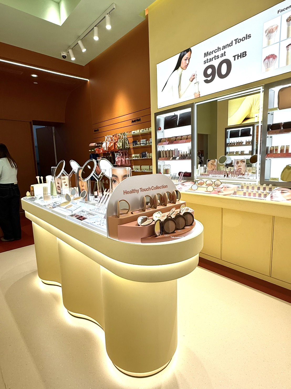 Cream display tables with cosmetics